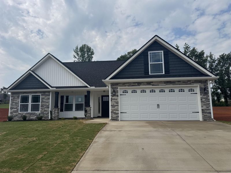 Front exterior of a new home in Ballentine Ridge, Lyman, SC, highlighting curb appeal (Image 7).