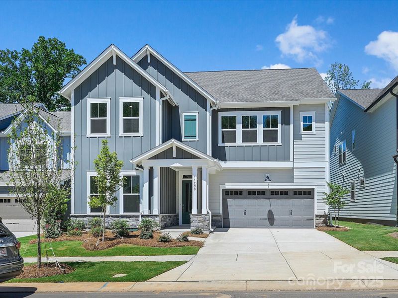 Front exterior of a new home in North Creek Village, Huntersville, NC, highlighting curb appeal (Image 24).