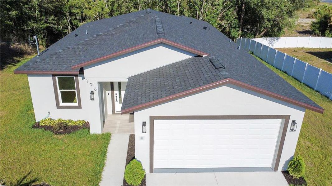 Front exterior of a new home in , Spring Hill, FL, highlighting curb appeal (Image 21).
