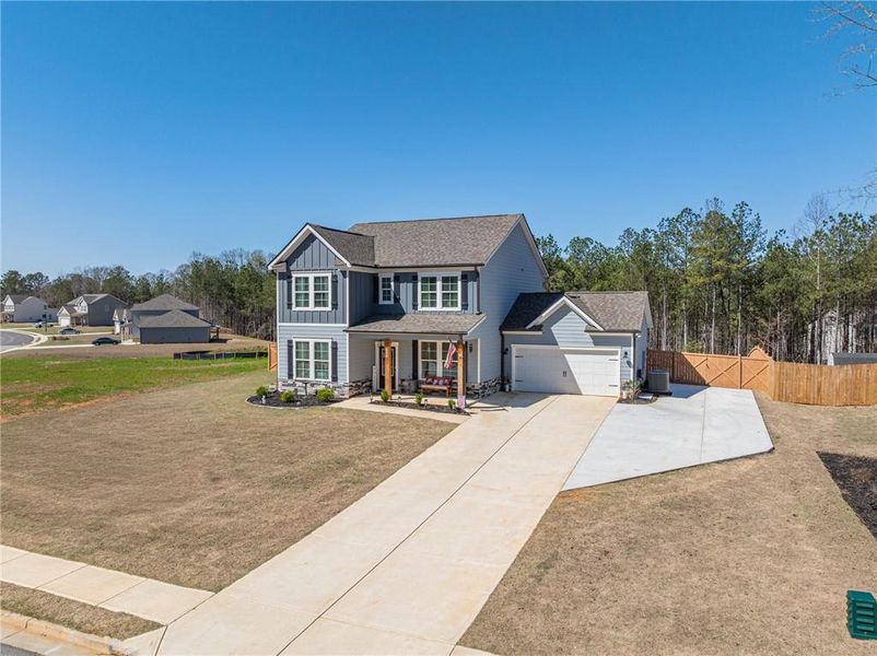 Front exterior of a new home in River Station, Monroe, GA, highlighting curb appeal (Image 23).