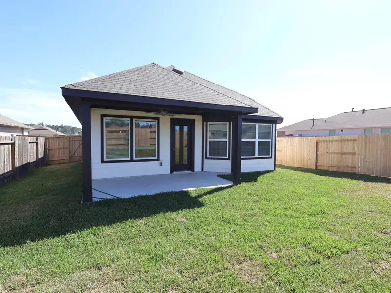 Exterior details and patio area of a home in Magnolia Ridge, Magnolia (Image 4).