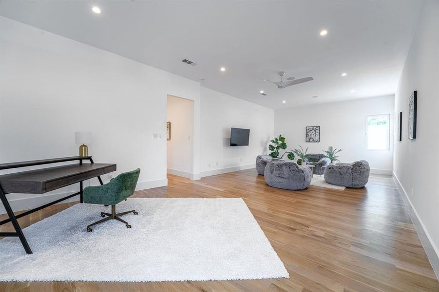 Office area with light hardwood / wood-style flooring and ceiling fan Office area with light hardwood / wood-style flooring and ceiling fan