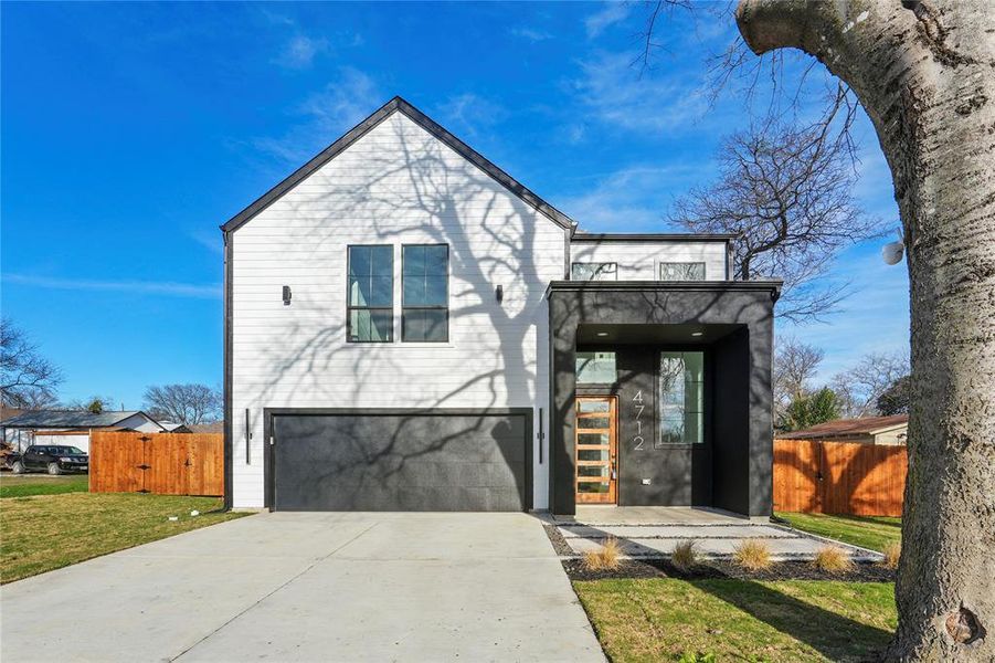 View of front of property featuring an attached garage and concrete driveway View of front of property featuring an attached garage and concrete driveway