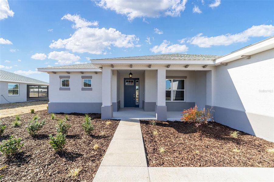Exterior details and patio area of a home in On Top of the World Communities, Ocala (Image 4).