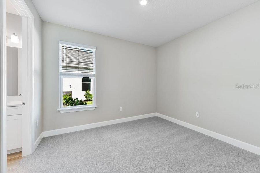 Spacious, unfurnished interior of a new home in Esplanade at Skye Ranch, Sarasota (Image 22).