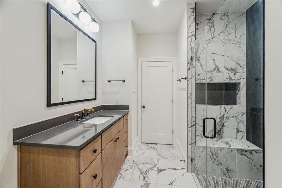 Second of two en-suite baths for secondary bedroom, this one with walk-in shower