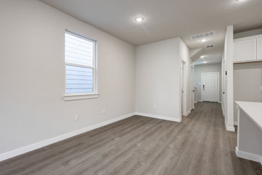 A room with white walls and wood floors. A room with white walls and wood floors.