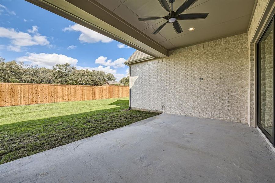 View of patio featuring ceiling fan