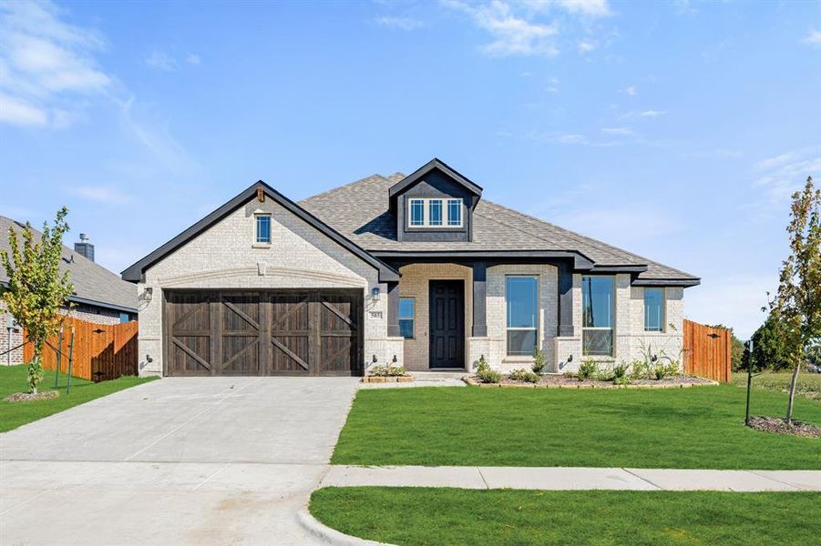 Front exterior of a new home in The Retreat at North Grove 60, Waxahachie, TX, highlighting curb appeal (Image 2). Front exterior of a new home in The Retreat at North Grove 60, Waxahachie, TX, highlighting curb appeal (Image 2).