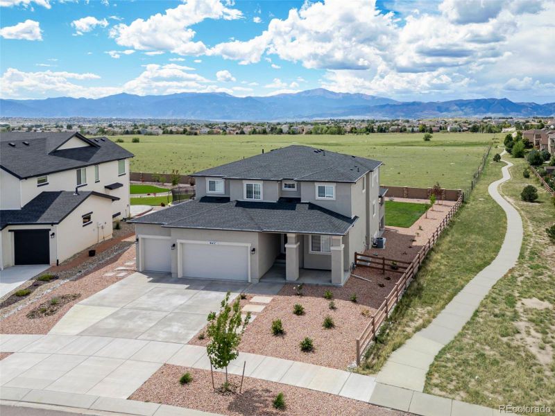 Front exterior of a new home in , Colorado Springs, CO, highlighting curb appeal (Image 2).