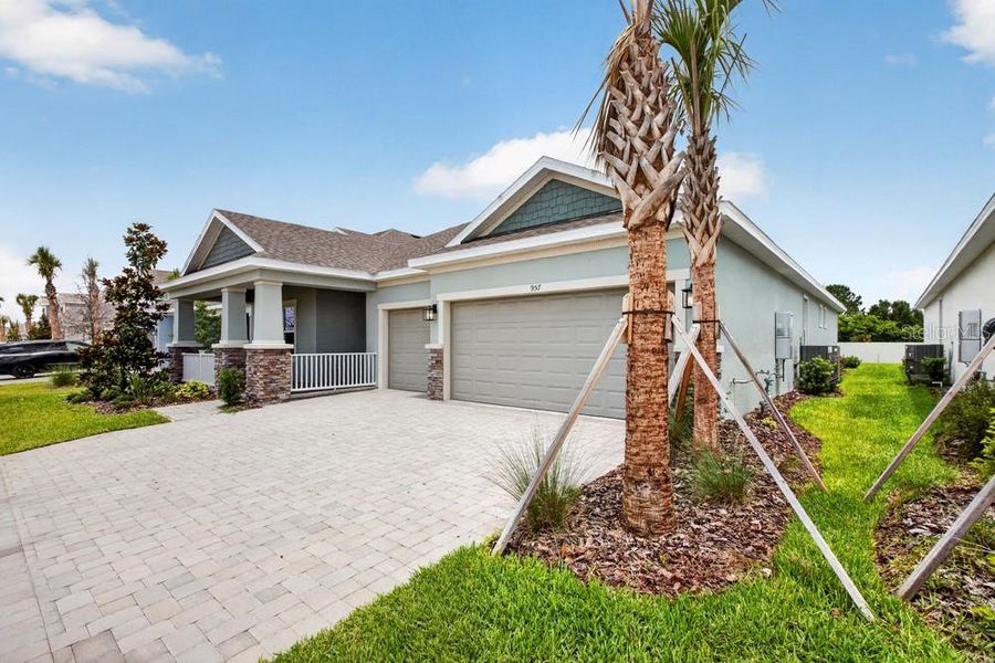 Front exterior of a new home in Center Lake Ranch Community Group Page, St. Cloud, FL, highlighting curb appeal (Image 1). Front exterior of a new home in Center Lake Ranch Community Group Page, St. Cloud, FL, highlighting curb appeal (Image 1).