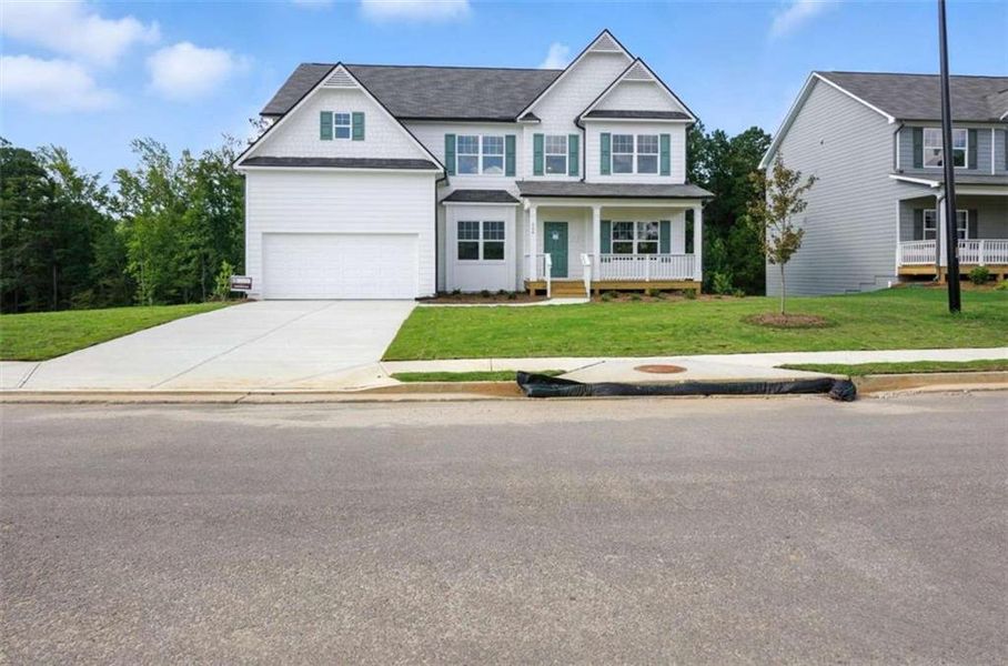 Front exterior of a new home in Creekside Landing, Dallas, GA, highlighting curb appeal (Image 1).
