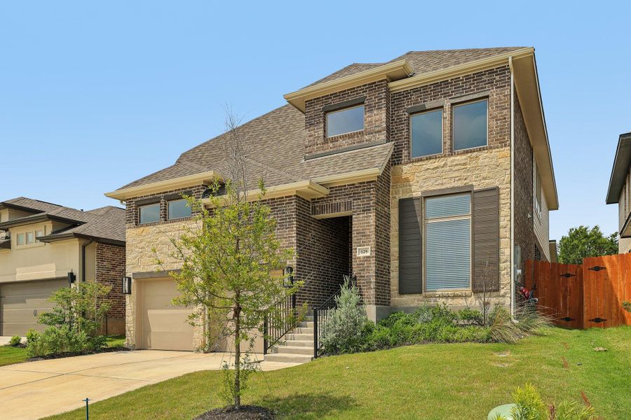View of front of house featuring concrete driveway, an attached garage, a shingled roof, and brick siding View of front of house featuring concrete driveway, an attached garage, a shingled roof, and brick siding