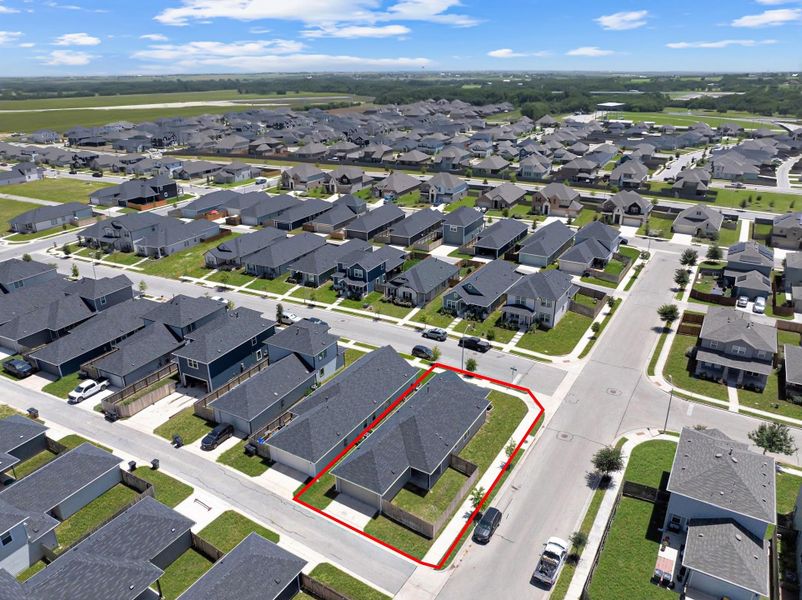 Aerial view of property and surrounding area featuring property boundaries highlighted Aerial view of property and surrounding area featuring property boundaries highlighted