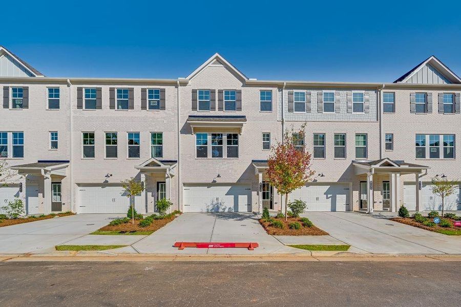 Front exterior of a new home in Chandler Run, Tucker, GA, highlighting curb appeal (Image 1).