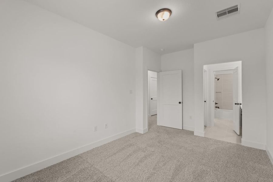 Representative unfurnished interior of a home built from the Sorenstam by Chesmar Homes in Riceland Alley Loads, Mont Belvieu (Image 77).