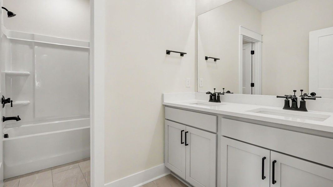 Secondary bathroom with dual vanity Secondary bathroom with dual vanity