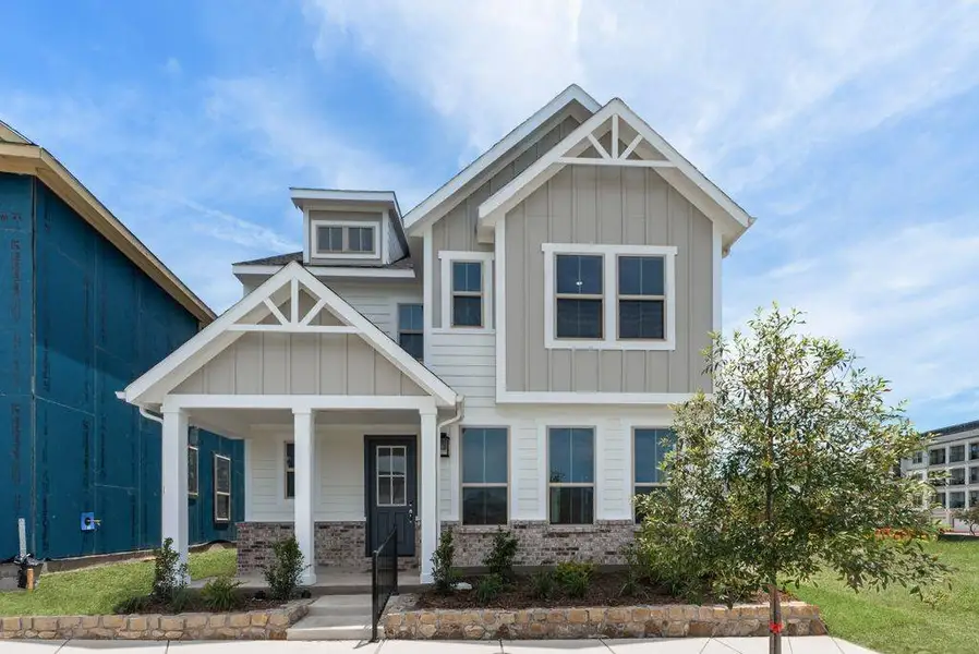 Front exterior of a new home in Bayside, Rowlett, TX, highlighting curb appeal (Image 23). Front exterior of a new home in Bayside, Rowlett, TX, highlighting curb appeal (Image 23).