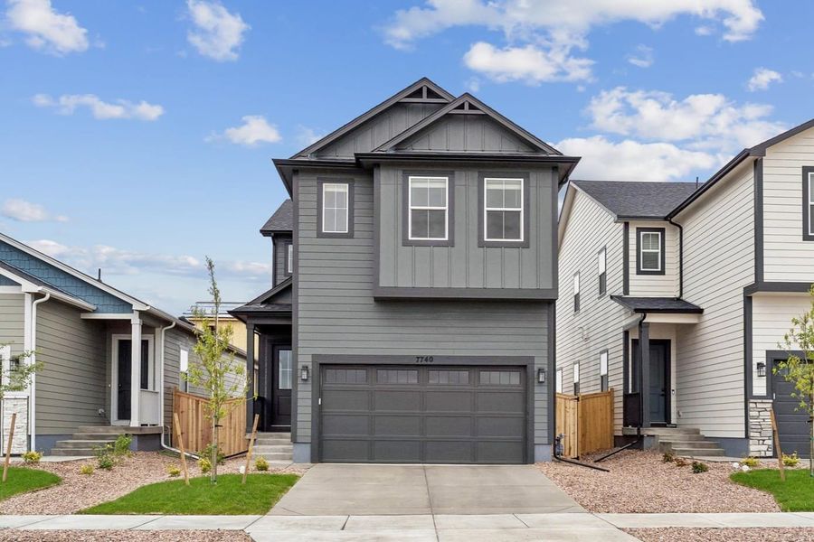 Front exterior of a new home in Aspen Meadows, Colorado Springs, CO, highlighting curb appeal (Image 2). Front exterior of a new home in Aspen Meadows, Colorado Springs, CO, highlighting curb appeal (Image 2).