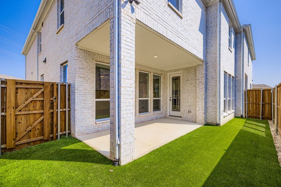 Front exterior of a new home in Castle Hills Northpointe - Townhomes, Lewisville, TX, highlighting curb appeal (Image 20).