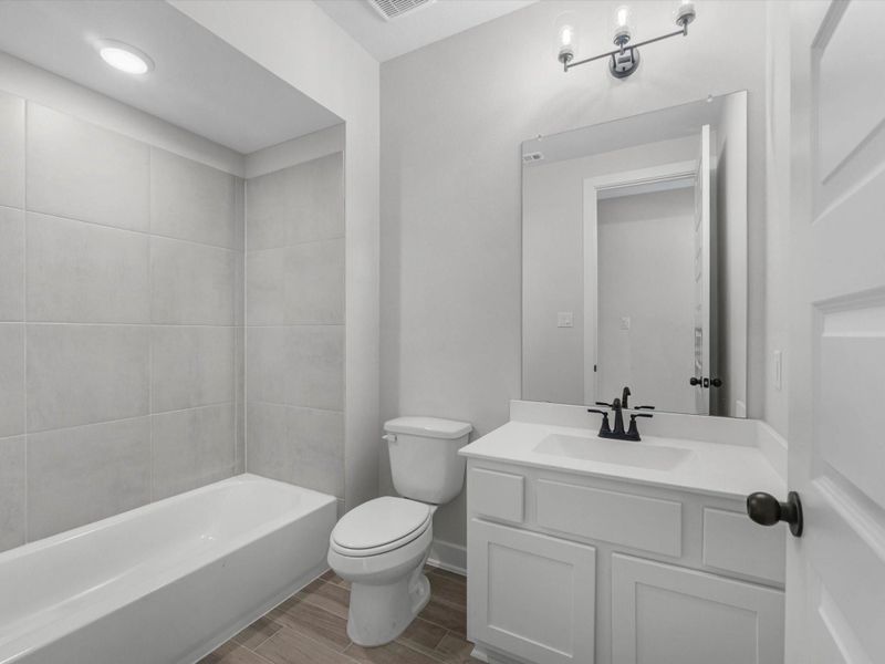 Furnished interior view inside a new home in Sienna, Missouri City (Image 8).