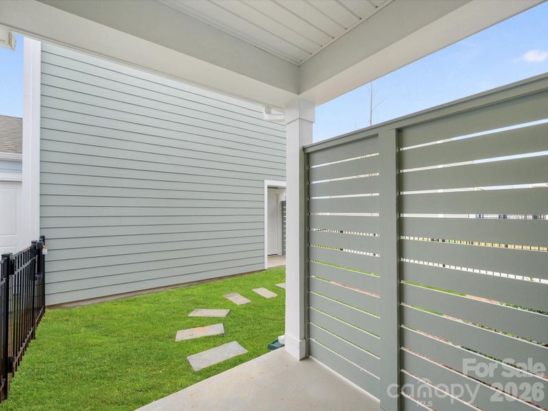 Exterior details and patio area of a home in North Creek Village, Huntersville (Image 4).