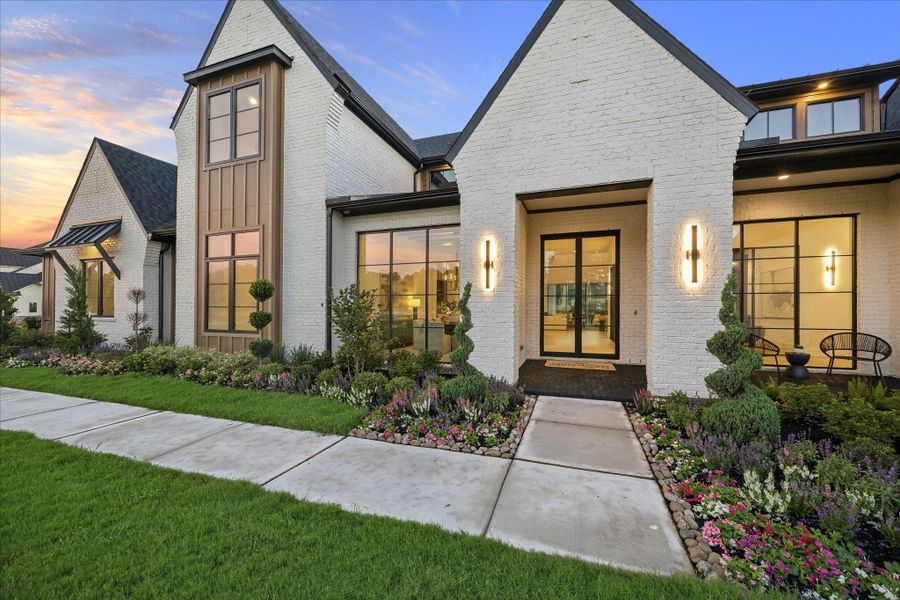 Front exterior of a new home in Stallion Lakes, Hockley, TX, highlighting curb appeal (Image 23).