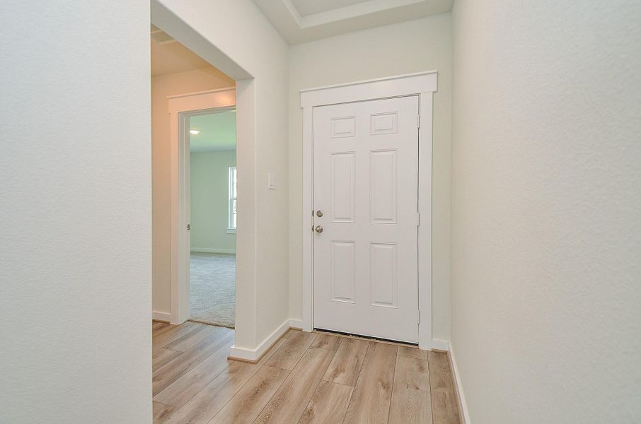 Spacious, unfurnished interior of a new home in Sunterra, Katy (Image 24).