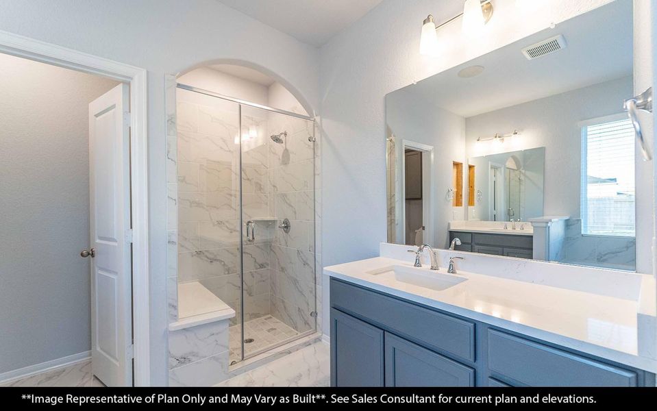 Step into the spa-inspired primary bathroom featuring a refreshing walk-in shower and dual vanity layout. It's the perfect blend of functionality and everyday indulgence. **Image Representative of Plan Only and May Vary as Built**.