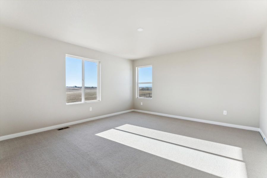 A room with a white floor and windows.