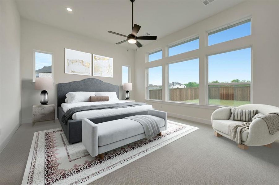 Carpeted bedroom with ceiling fan and recessed lighting