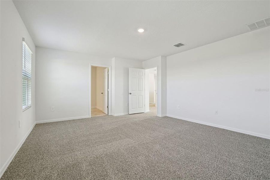 Spacious, unfurnished interior of a new home in Lake Deer Estates - Signature Series, Poinciana (Image 38).