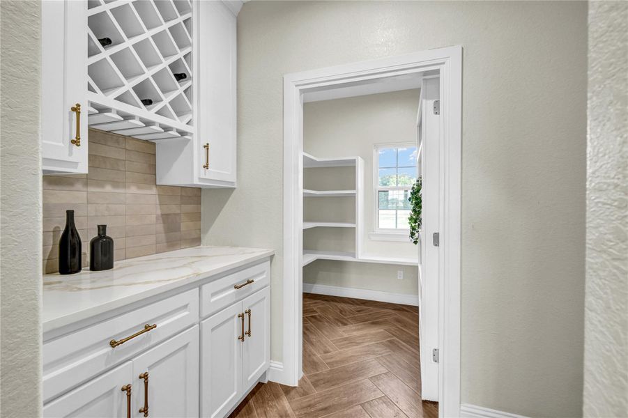 Butler's pantry with dor to hidden pantry open Butler's pantry with dor to hidden pantry open