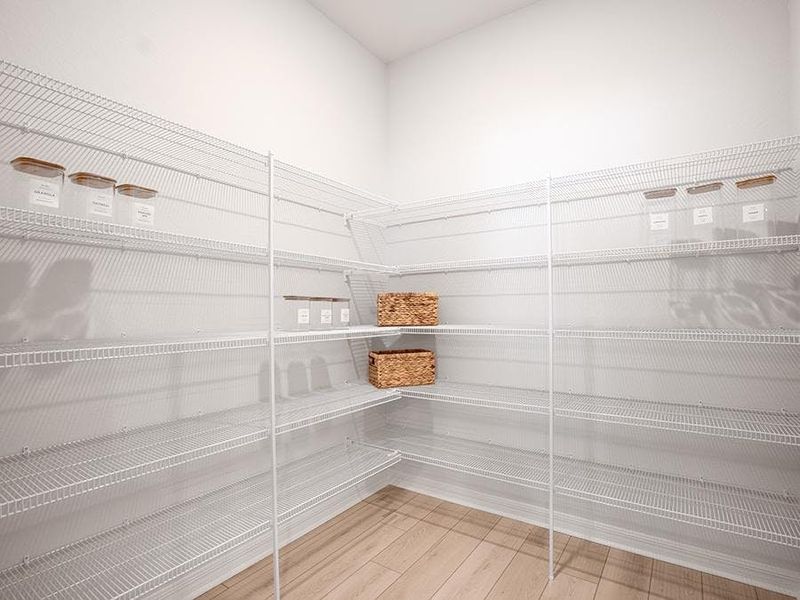 A walk-in pantry provides storage convenience - Shelby II by Highland Homes