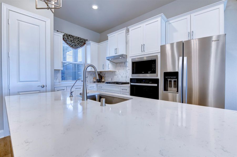 Modern kitchen with oversized island, sleek cabinetry, and open-concept design perfect for entertaining.