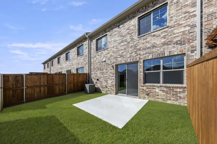 Exterior details and patio area of a home in Wildridge, Oak Point (Image 4).