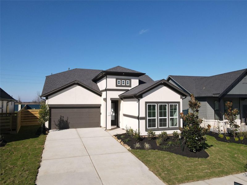 Front exterior of a new home in Austin Point, Richmond, TX, highlighting curb appeal (Image 12).