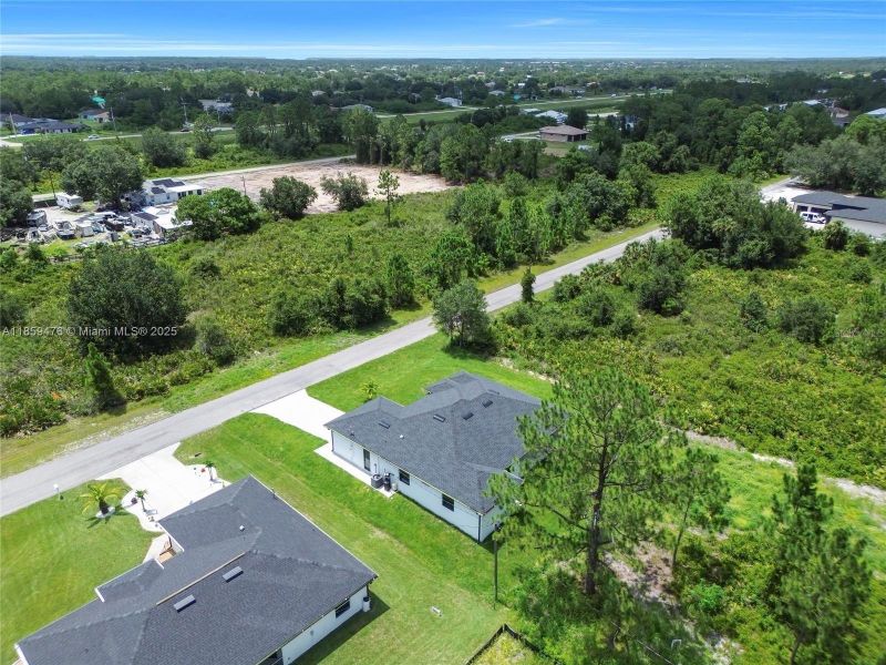 Front exterior of a new home in , Lehigh Acres, FL, highlighting curb appeal (Image 18). Front exterior of a new home in , Lehigh Acres, FL, highlighting curb appeal (Image 18).