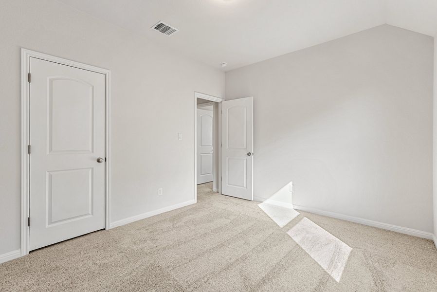 Representative unfurnished interior of a home built from the Somerville by Ashton Woods in Willow Springs, Buda (Image 41).