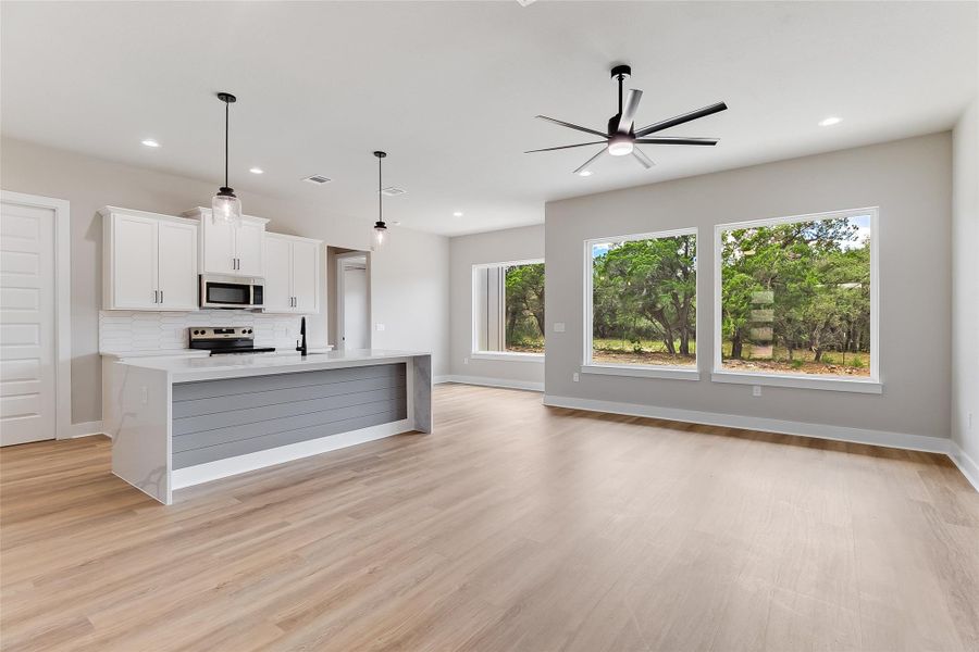 Open floor plan with oversized windows Open floor plan with oversized windows
