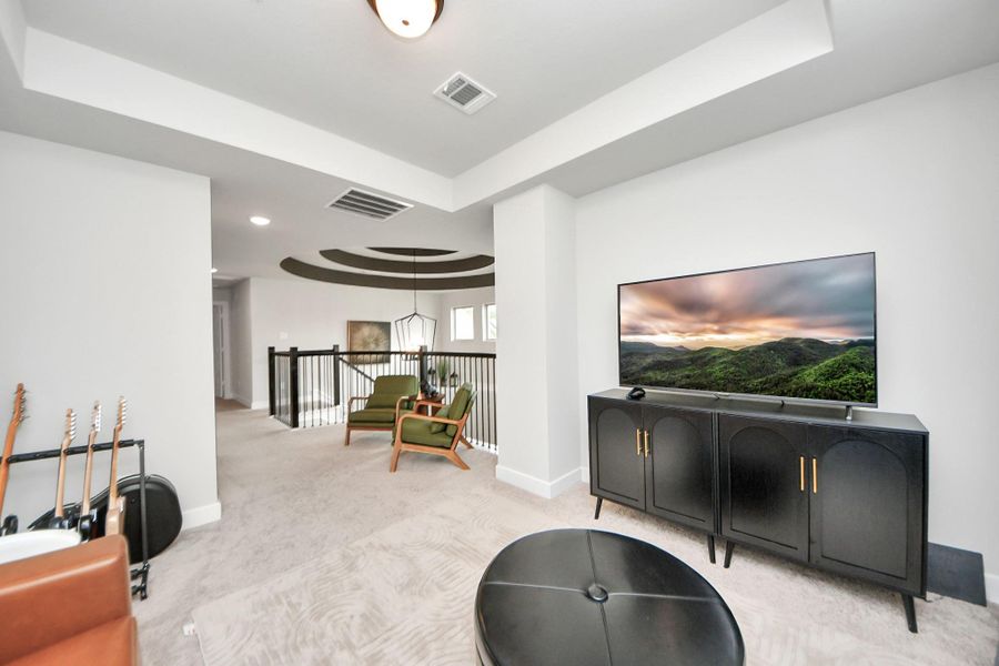 Light-filled gameroom with open sightlines and ample seating space.