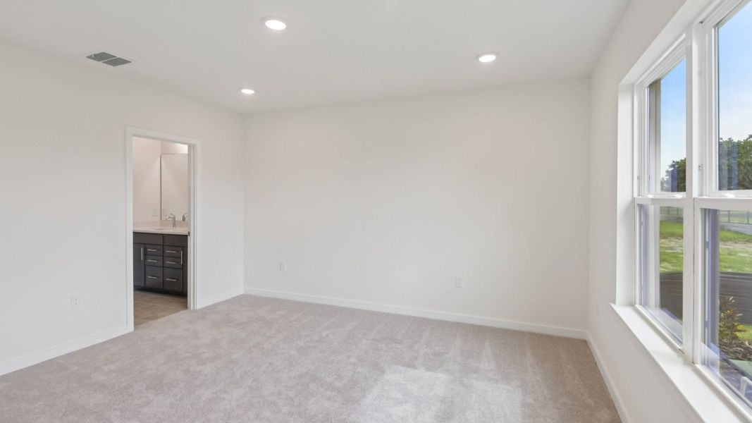 Furnished interior view inside a new home in Grasslands West, Lakeland (Image 17).