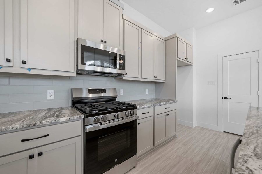 Furnished interior view inside a new home in Bridgeland, Cypress (Image 11).