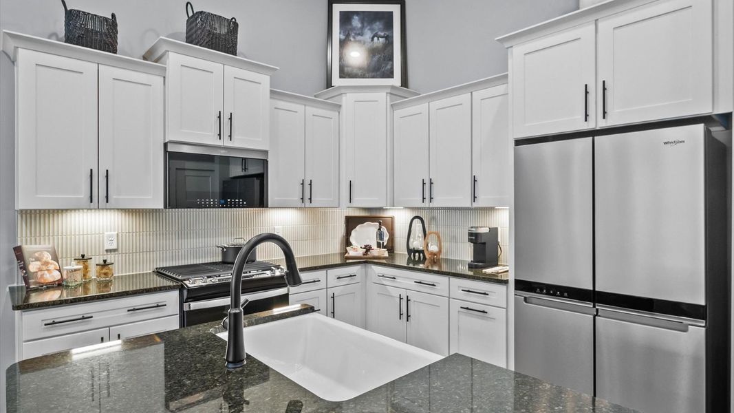 Modern kitchen with streamlined island for easy prep, storage, and gathering