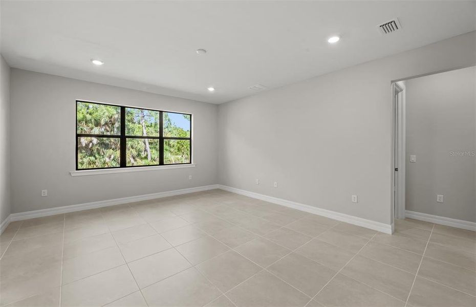 Spacious, unfurnished interior of a new home in Cedar Grove at The Woodlands, North Port (Image 14).