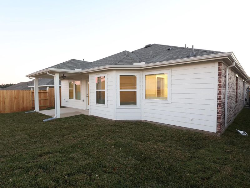 Exterior details and patio area of a home in Magnolia Ridge, Magnolia (Image 21).