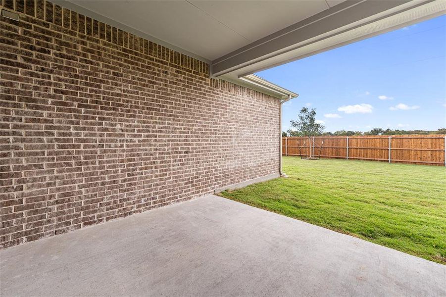 Fenced backyard with a patio Fenced backyard with a patio