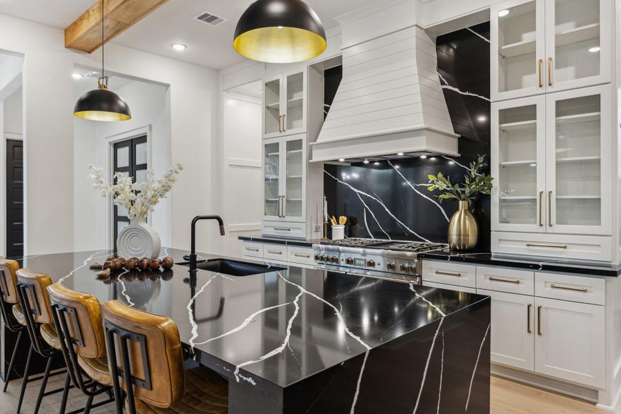 Luxurious finishes, copious amounts of storage, high-end appliances, this kitchen has it all! Luxurious finishes, copious amounts of storage, high-end appliances, this kitchen has it all!