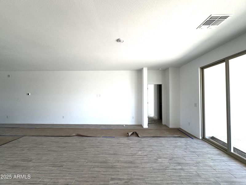 18 - Great Room looking into Primary Sui 18 - Great Room looking into Primary Sui