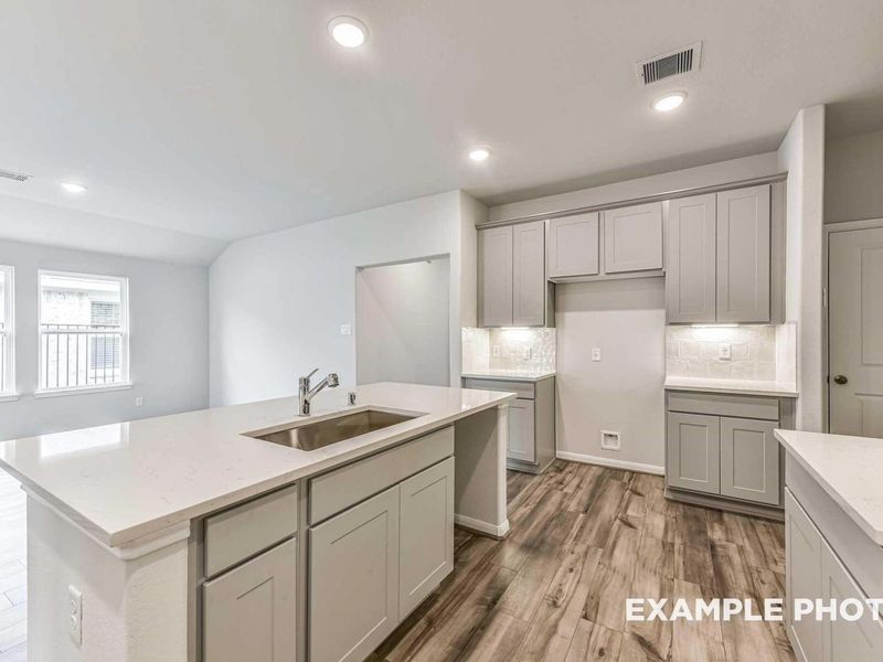 Furnished interior view inside a new home in Sunterra, Katy (Image 8).